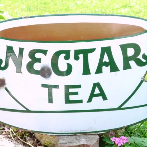 image of enamel teacup sign